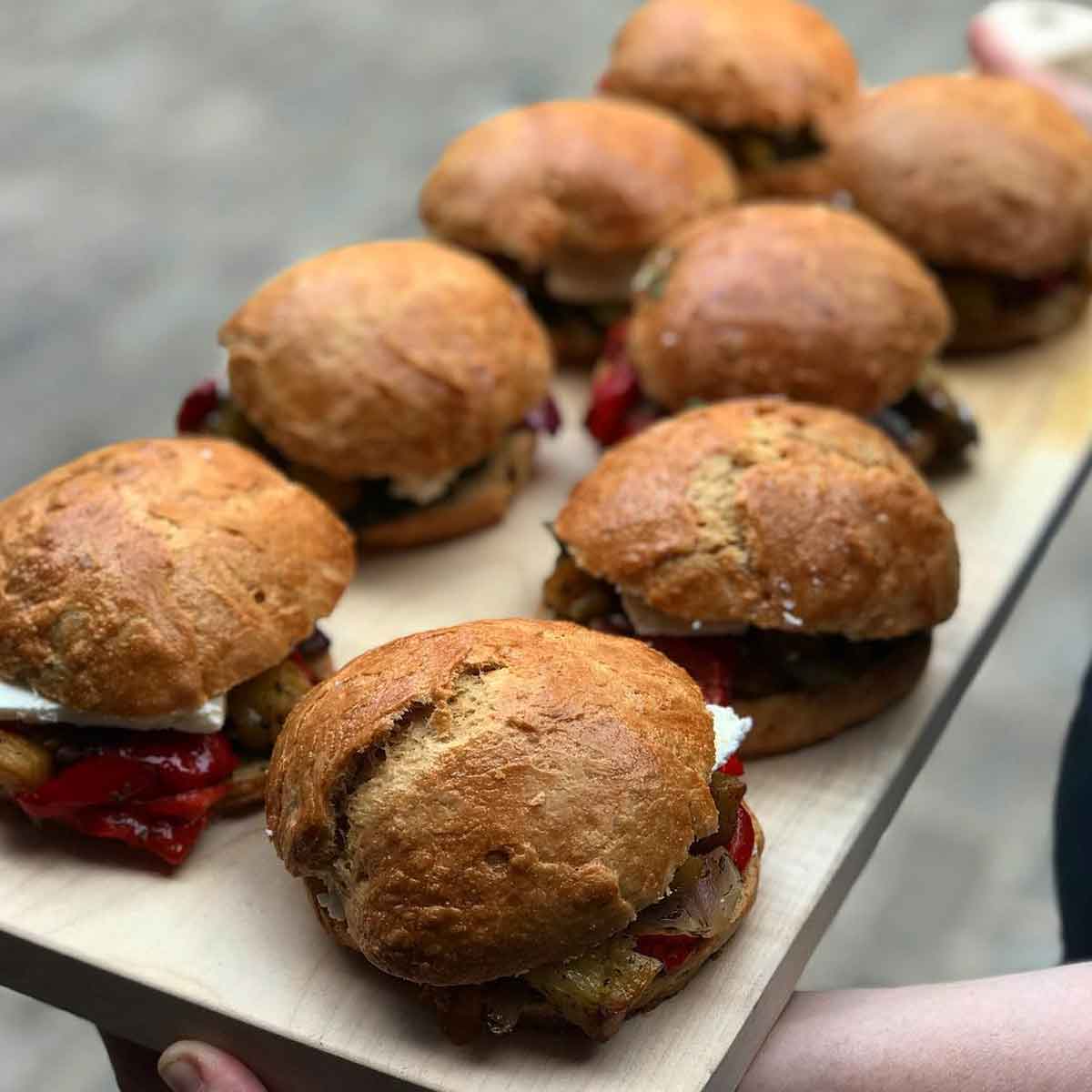 Roasted Ras El Hanout vegetables with barrel aged feta & pesto in sourdough rolls